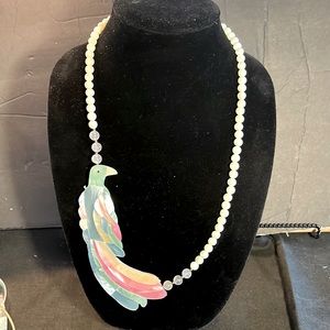 Artistic piece beautiful inlayed in mother of pearl finish bird over 5” in size